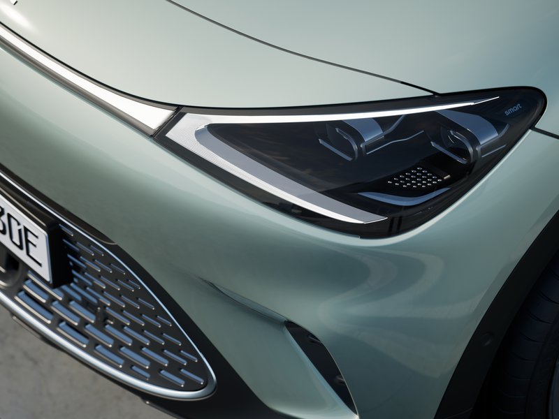 eu-premium-darkmatter-futuregreen-eclipseblack-ext-028-headlight-detail-urban.jpeg